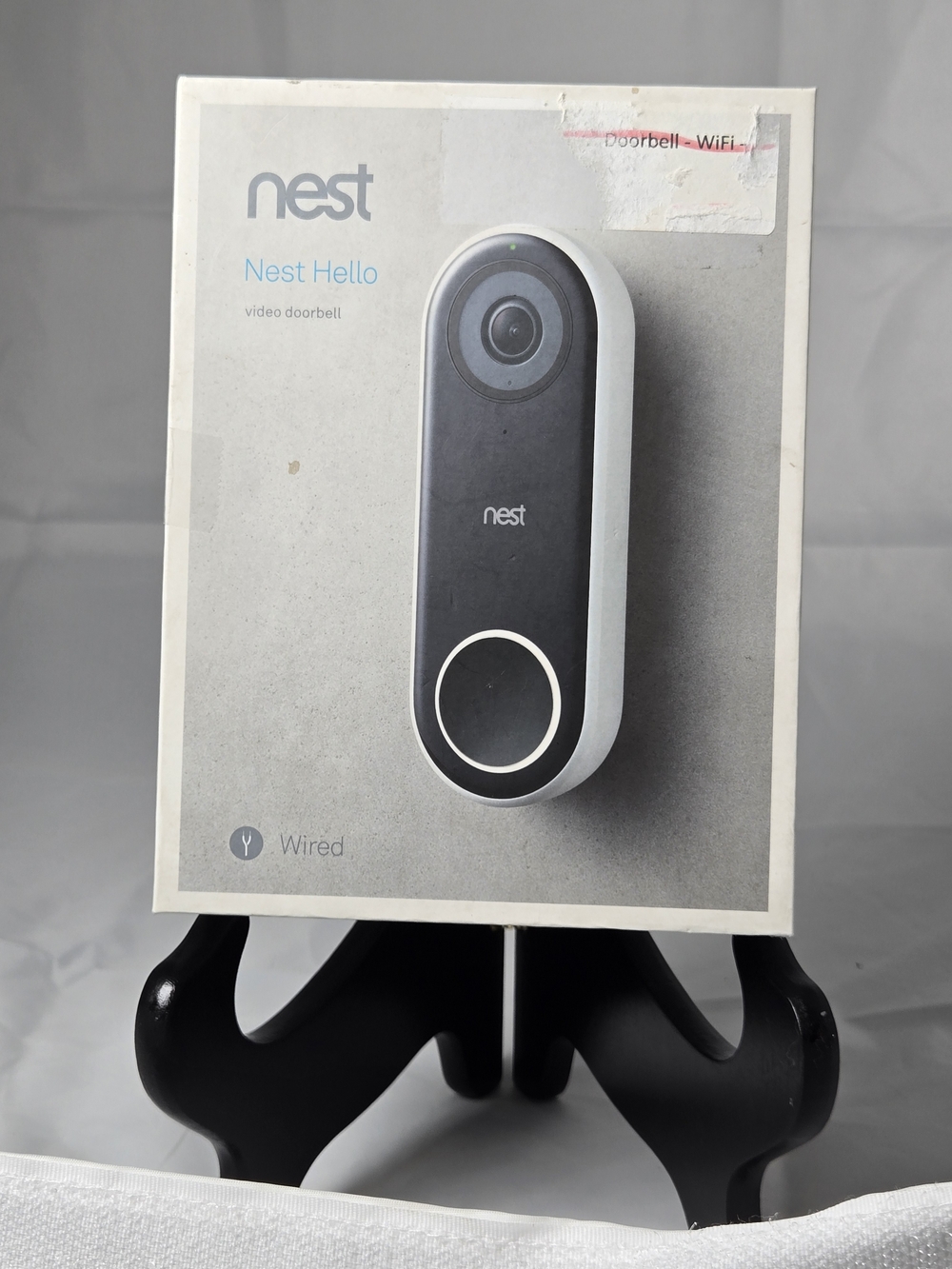 NEST Fragrances Poster Featuring White Smartphone and Blue App Icons
